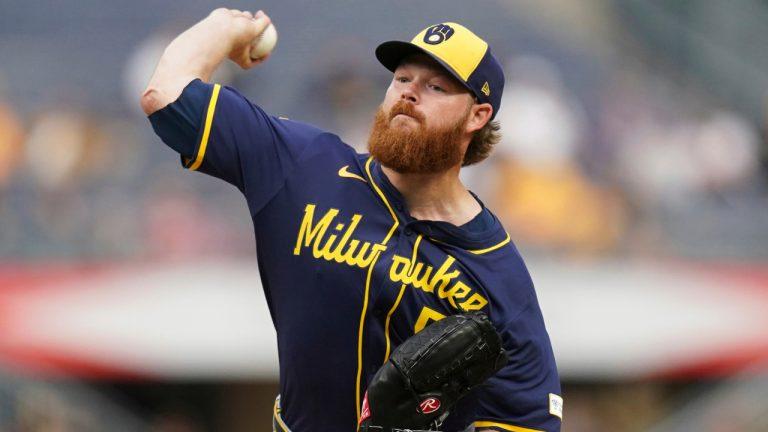 Woodruff’s playoff hopes take hit after landing on IL with lat strain – MLB.com